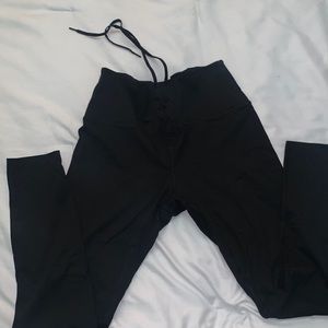 Pink Victoria Secrets black leggings. Size Large.